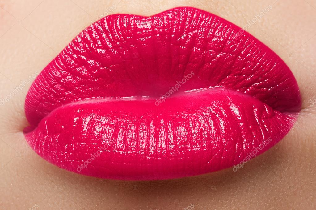 Close-up of a beautiful sexy red lips giving kiss. Nice full lips with ...
