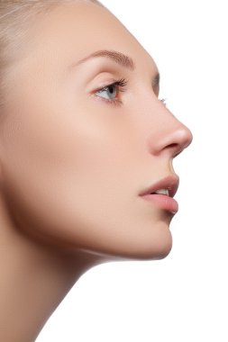 Beautiful face of young adult woman with clean fresh skin - isolated. Beautiful girl with beautiful makeup, youth and skin care concept. Portrait of beautiful young blond woman with clean face. Cosmetics and make-up