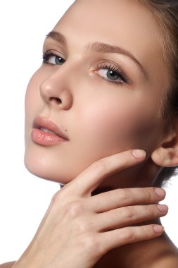 Beautiful young woman with clean fresh skin. Portrait of beautiful young girl with clean skin on pretty face - white background. Beauty portrait. Beautiful spa woman smiling. Perfect fresh skin. Pure beauty model. Youth and skin care concept