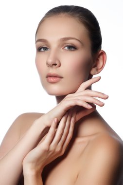 Spa woman. Natural beauty face. Beautiful girl touching her face. Perfect skin. Skincare. Young Skin. Manicured nails. Cosmetics & makeup
