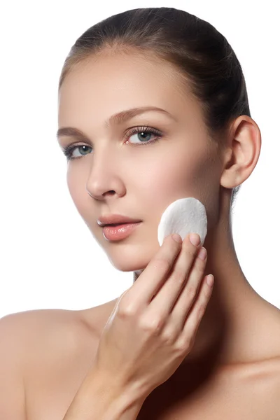 Happy european woman with cotton pad, isolated on white background. Beauty fresh girl cleaning face with cotton swab. Beautiful young woman cleaning her face with cotton — 스톡 사진