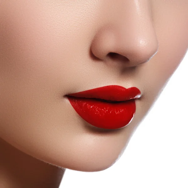 Close-up shot of woman lips with glossy red lipstick. Glamour red lips make-up, purity skin. Retro beauty style. Beautiful model girl with beauty makeup, red lips, perfect fresh skin. Youth and Skin Care Concept — 스톡 사진