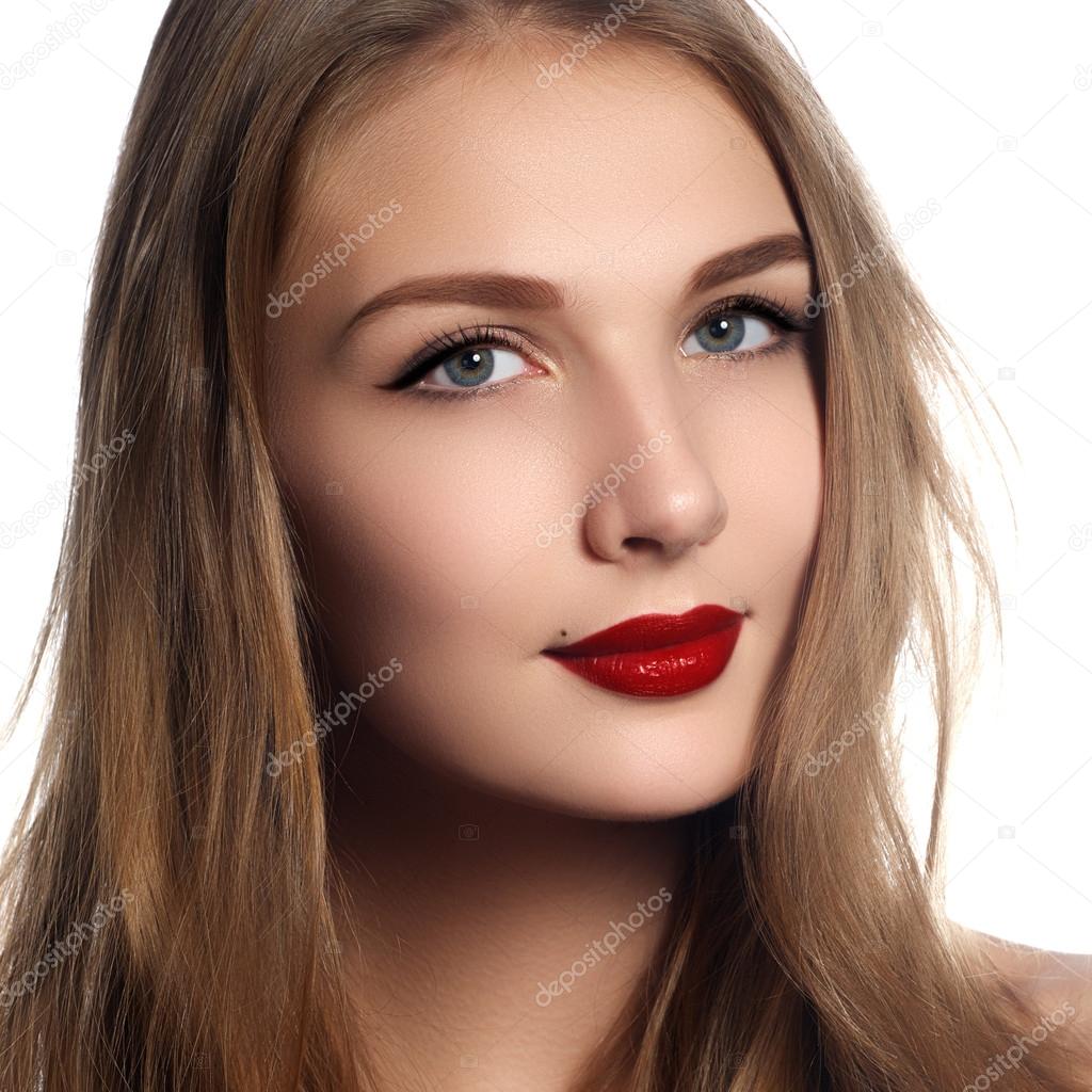 Health, beauty, wellness, haircare, cosmetics and make-up. Beautiful fashion hairstyle. Woman model with shiny straight long hair and evening retro make-up. Red lips