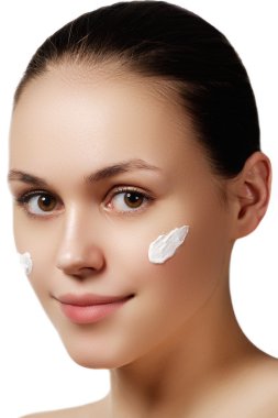 Beautiful face of young adult woman with clean fresh skin - isolated on white. Portrait of beautiful young blond woman with clean face