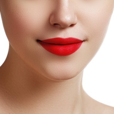 Sexy lips. Beauty red lips makeup detail. Beautiful make-up closeup. Sensual mouth. Lipstick and lipgloss. Beauty model woman's face close-up