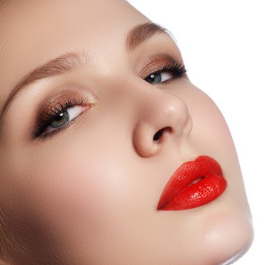 Wellness, cosmetics and chic retro style. Close-up portrait of sensuality beautiful woman model face with fashion make-up and sexy evening red lips makeup. High fashion look.glamor closeup portrait of beautiful sexy stylish