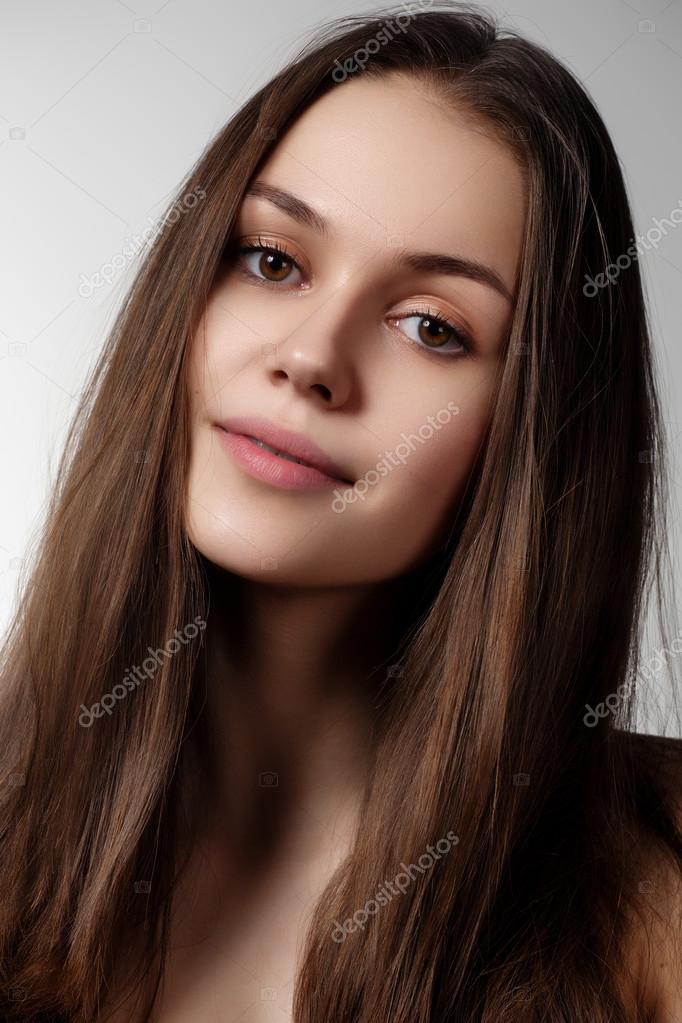 Volume Hair. Beauty Woman with Very Long Healthy and Shiny Smooth Brown Hair.  Model Brunette Girl Portrait isolated on a gray background. Gorgeous Hair  Stock Photo by ©looking_2_the_sky 90483386