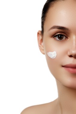 Make-up & cosmetics. Closeup portrait of beautiful woman model face with clean skin on white background. Natural skincare beauty, clean soft skin. Spa treatment