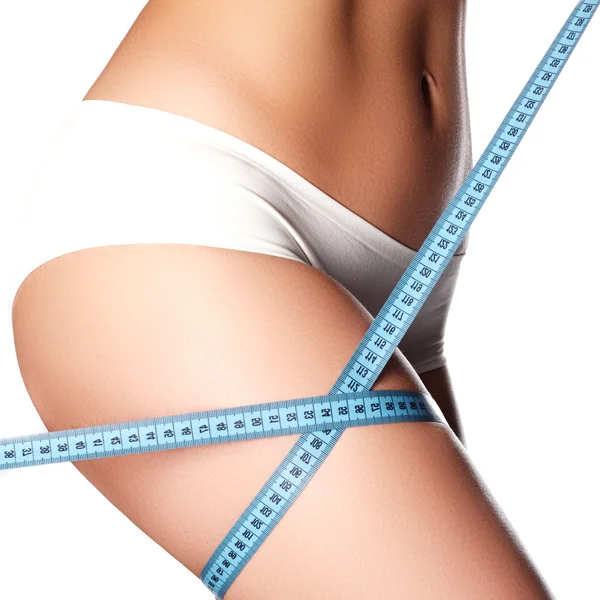 Woman measuring perfect shape of beautiful hips. Healthy lifestyles concept. Woman body part is being measured. Spa beauty part of body. Healthy lifestyle, diet and fitness. Perfect waist, butt and legs — Stock Photo, Image