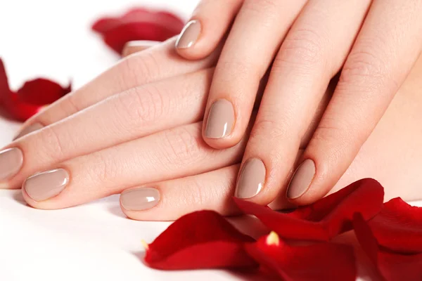 Manicure, hands & spa. Beautiful woman hands, soft skin, beautiful nails. Healthy woman hands. Beauty salon. Beauty treatment. Female nails