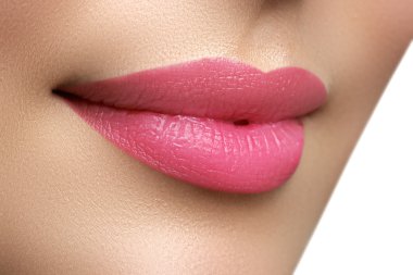 Perfect smile. Beautiful full pink lips. Pink lipstick. Gloss lips. Make-up & Cosmetics