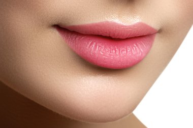 Perfect smile. Beautiful full pink lips. Pink lipstick. Gloss lips. Make-up & Cosmetics