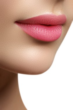 Perfect smile. Beautiful full pink lips. Pink lipstick. Gloss lips. Make-up & Cosmetics
