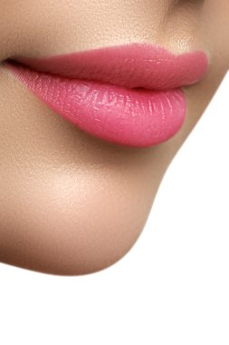 Perfect smile. Beautiful full pink lips. Pink lipstick. Gloss lips. Make-up & Cosmetics