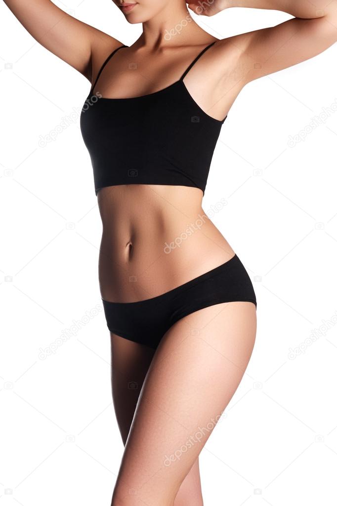 Beautiful woman body.Perfect shining skin for summer. Slim tanned woman's  body. Isolated over white background. Beautiful sexy female slim tanned body  Stock Photo by ©looking_2_the_sky 88908284