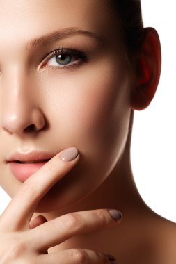Make-up & cosmetics. Closeup portrait of beautiful woman model face with clean skin on white background. Natural skincare beauty, clean soft skin. Spa treatment