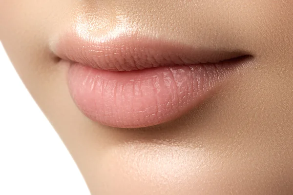 Close-up of woman's lips with fashion natural beige lipstick makeup. Perfect Lips. Sexy Girl Mouth close up. Beauty young woman Smile. Natural plump full Lip. Lips augmentation. Close up detail — Stock fotografie