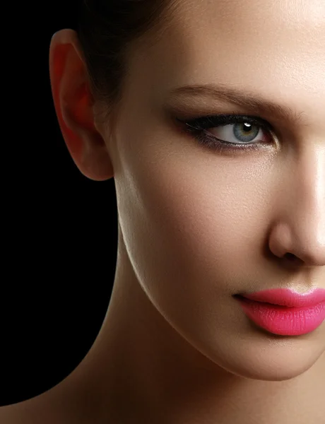 Mascara Applying. Long Lashes closeup. Mascara Brush. Eyelashes extensions. Makeup for Blue Eyes. Eye Make up Apply, pink lips Stock Picture