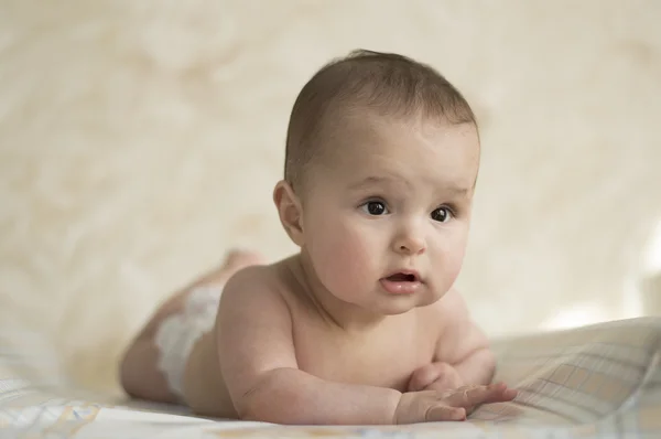 Baby lying on his stomach — Stock Photo, Image