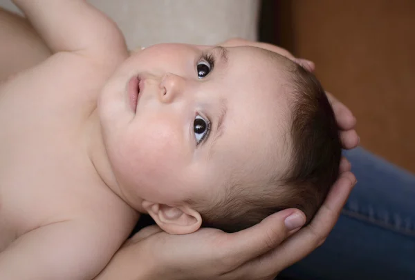 Baby in the arms  of a caring mother — Stock Photo, Image