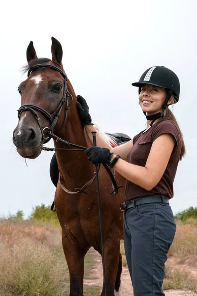 Rider Black Gloves Black Riding Helmet Stands Next Her Saddled Royalty Free Stock Photos