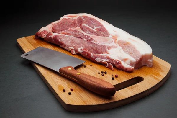Pork meat on cutting board