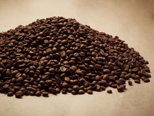 Coffee beans on paper background — Stock Photo, Image