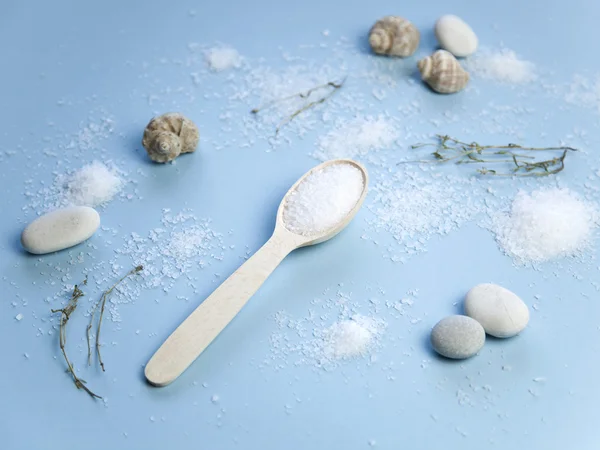 Sea salt on blue background — Stock Photo, Image