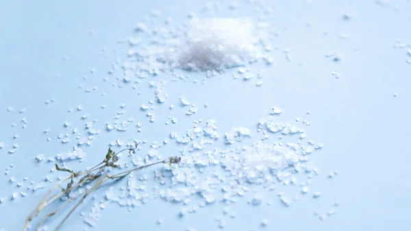 Sea salt on blue background — Stock Photo, Image