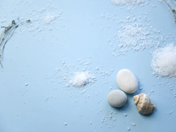 Sea salt on blue background — Stock Photo, Image