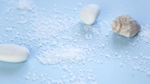 Sea salt on blue background — Stock Photo, Image