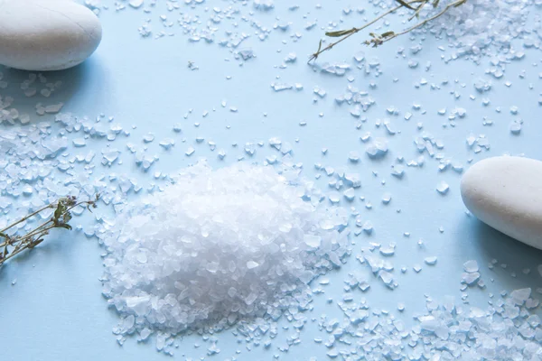 Sea salt on blue background — Stock Photo, Image