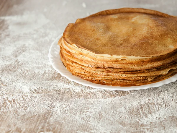 Russian taste pancakes on wooden table — Stock Photo, Image