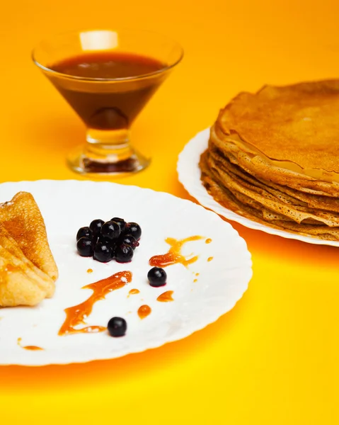 Russian taste pancakes with black currant — Stock Photo, Image