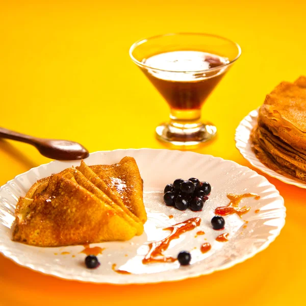 Russian taste pancakes with black currant — Stock Photo, Image