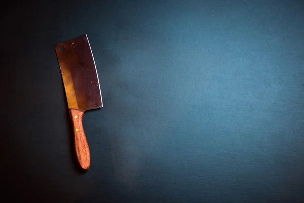 Kitchen axe on grunge background