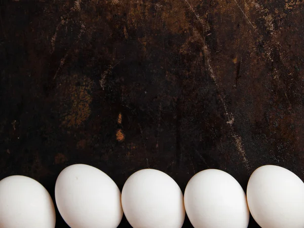 Eggs on dark background — Stock Photo, Image