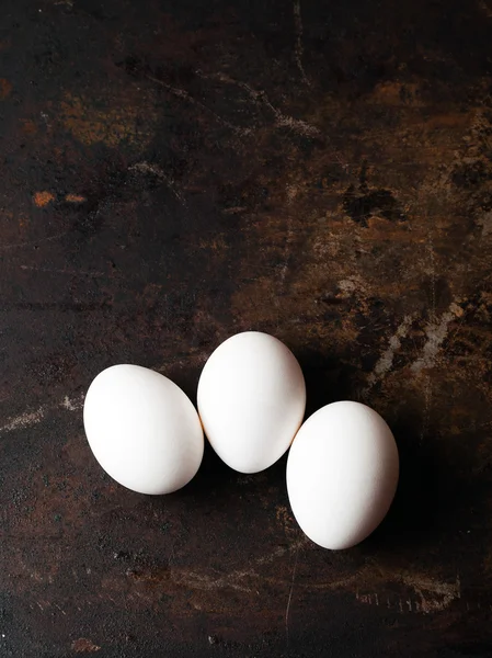 Eggs on dark background. — Stock Photo, Image