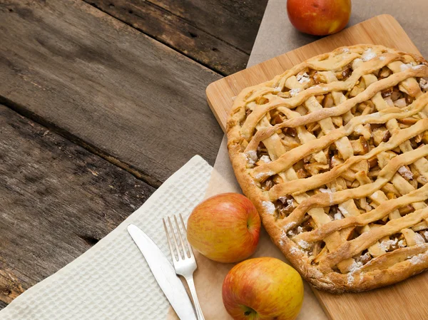 Apple pie on a dark wood background — Stock Photo, Image