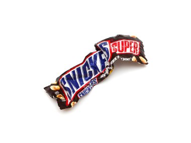 ORENBURG, RUSSIA - SEPTEMBER 30: Recycled crumpled wrapper from a Snickers Super chocolate bar made by Mars, Inc. clipart