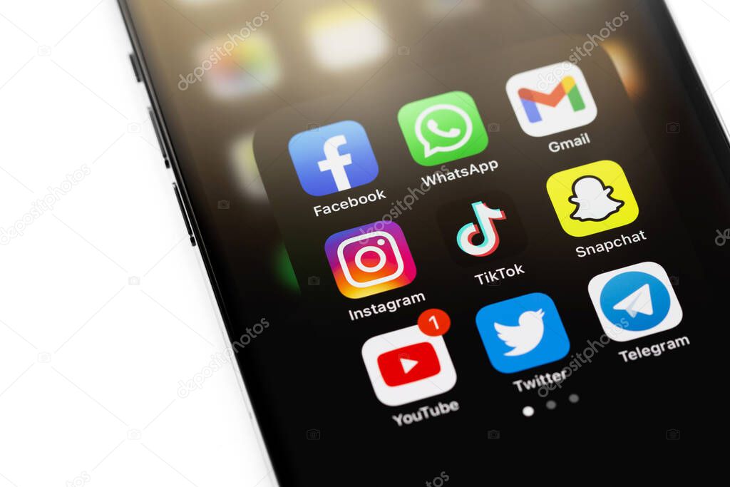 Showing social media mobile app icons of Facebook, WhatsApp, YouTube, Instagram, TikTok, Snapchat, Telegram, Twitter on a display smartphone. Moscow, Russia - December 5, 2020