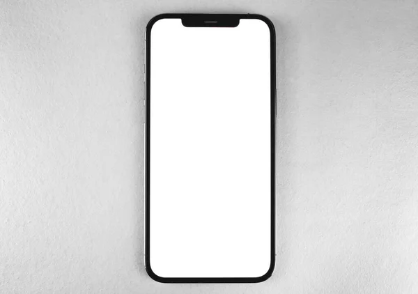 スマートフォンのモックアップグレーの背景に空白の白い画面でIphone Proのマックス トップビュー Appleは多国籍テクノロジー企業です モスクワ ロシア 2021年1月14日 — ストック写真