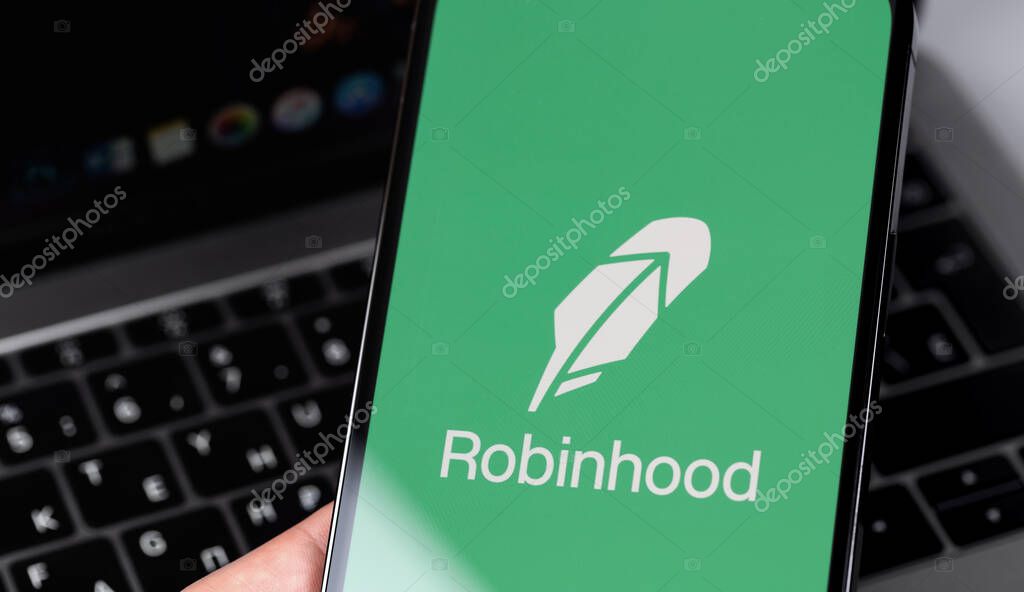 Robinhood mobile app on screen smartphone, iPhone in hand. Robinhood Markets, Inc. - American company providing financial services. Moscow, Russia - February 16, 2021