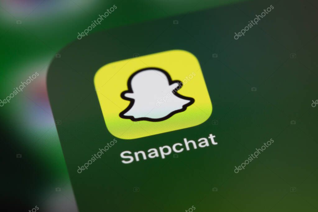 Snapchat mobile icon app on screen smartphone, iPhone closeup. Snapchat is a mobile messaging app with attached photos and videos. Moscow, Russia - June 14, 2021