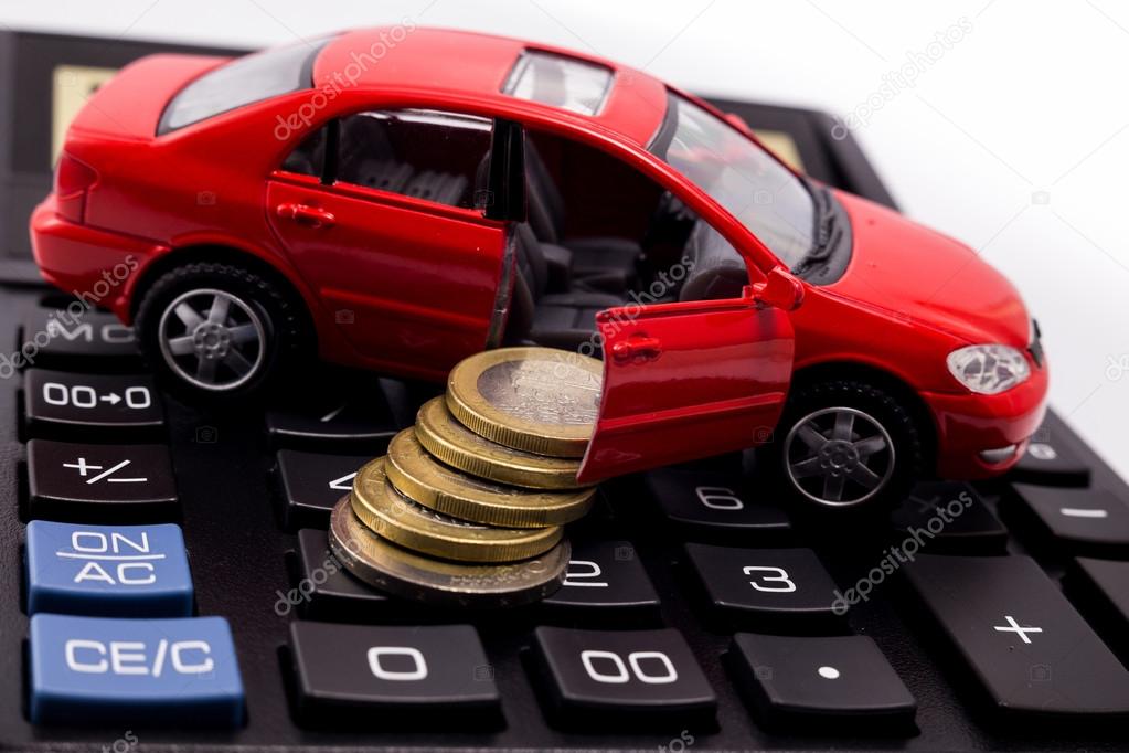 car model, coins on a calculator