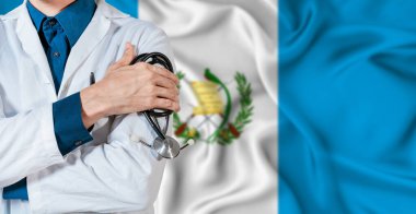 Guatemala healthcare concept. Doctor with stethoscope on Guatemala flag. Doctor holding stethoscope on Guatemalan flag