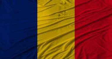 Çad bayrağı dalgalanıyor. Kumaş desenli Çad bayrağı