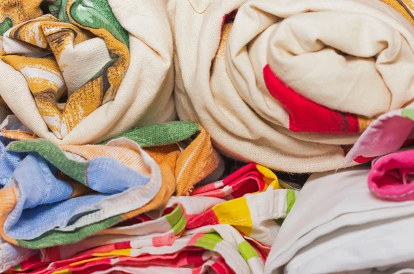 Linens rolled rolls piled stacks in a closet, cabinet furniture — Stock Photo, Image