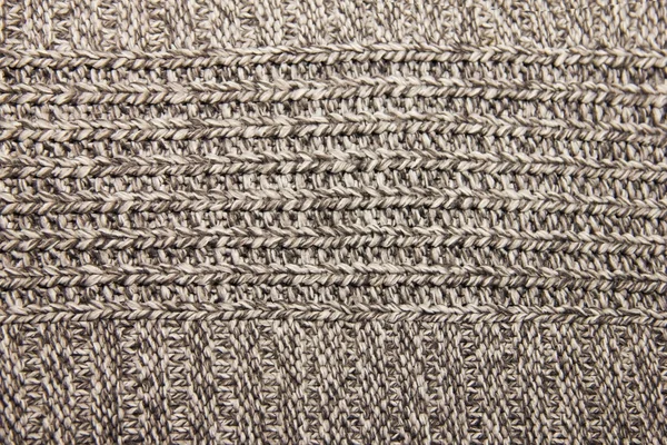 Graue Strickwolle gestrickte warme Kleidung für den Winterstoff tex — Stockfoto