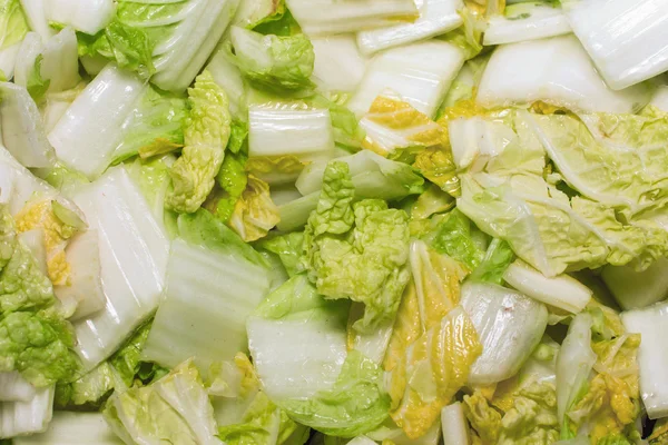 Фон, текстура нарізаного капустяного салату — стокове фото